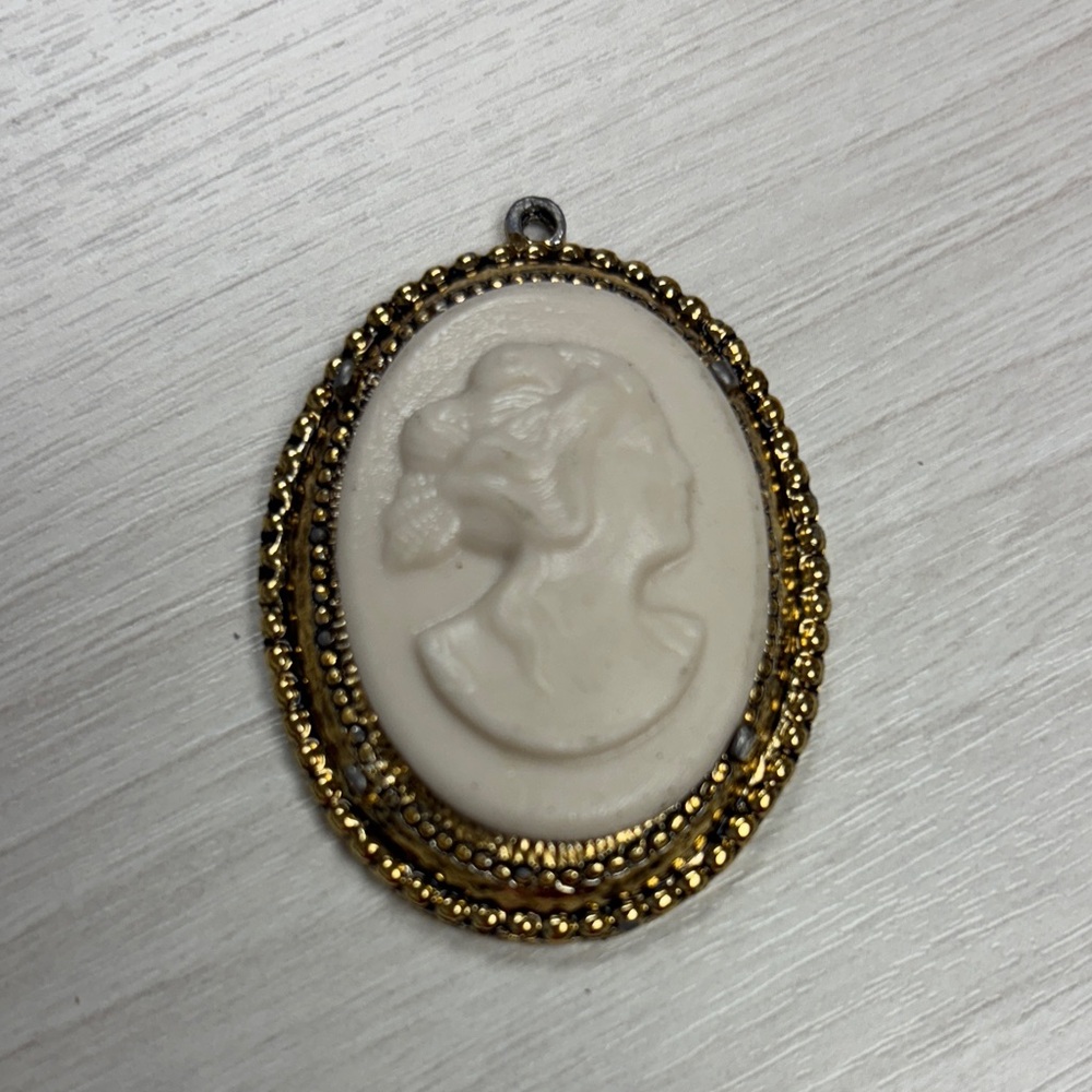Elegant Gold and Cream Cameo Pendant